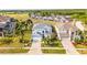 Aerial view of charming two-story home with mature landscaping and lawn at 119 Horton Park Dr, Davenport, FL 33897