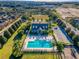 Aerial view of the community pool and clubhouse, and the surrounding neighborhood at 1197 Tallow Rd, Apopka, FL 32703