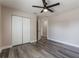 Bright bedroom featuring wood-look flooring, a ceiling fan, and a closet at 1197 Tallow Rd, Apopka, FL 32703