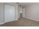 Bedroom featuring wall-to-wall closets, neutral carpeting, and ample space at 1197 Tallow Rd, Apopka, FL 32703