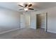 Bedroom with carpeting, ceiling fan, and large closet at 1197 Tallow Rd, Apopka, FL 32703