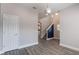 Bright entryway features wood-look floors, modern lighting, and access to the staircase at 1197 Tallow Rd, Apopka, FL 32703