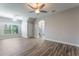 Bright living area with tile floors, archway, ceiling fan, and natural light at 1197 Tallow Rd, Apopka, FL 32703