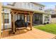 Inviting backyard area with a charming wooden pergola, perfect for outdoor grilling and entertaining guests at 1638 Swallowtail Ln, Sanford, FL 32771