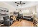 Bedroom featuring hardwood floors, built in bunk, and comfortable seating area at 1638 Swallowtail Ln, Sanford, FL 32771