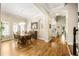 Traditional dining room features a wood table, chandelier, and beautiful hardwood floors at 1638 Swallowtail Ln, Sanford, FL 32771