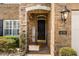 Up close exterior showcasing a charming brick entryway with a 'Welcome' sign and manicured landscaping at 1638 Swallowtail Ln, Sanford, FL 32771