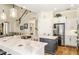 Spacious kitchen with large marble island, stainless appliances, and bar stool seating at 1638 Swallowtail Ln, Sanford, FL 32771