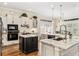 Well-lit kitchen boasting stainless steel appliances, dual islands, and modern white cabinetry at 1638 Swallowtail Ln, Sanford, FL 32771