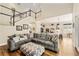 This home features a comfortable living area with high ceilings, a staircase, and wood flooring at 1638 Swallowtail Ln, Sanford, FL 32771