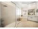 Bathroom featuring a glass enclosed shower, soaking tub and neutral tiling at 1638 Swallowtail Ln, Sanford, FL 32771