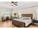 Spacious main bedroom boasts hardwood floors, plantation shutters, and a cozy fireplace at 1638 Swallowtail Ln, Sanford, FL 32771