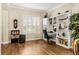 Bright and spacious home office with built-in shelving, hardwood floors, and a large window at 1638 Swallowtail Ln, Sanford, FL 32771