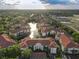 Stunning aerial view of the community featuring lush landscaping and a serene pond with fountains at 2615 Maitland Crossing Way # 9 307, Orlando, FL 32810