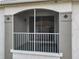 Exterior view of the screened-in outdoor balcony offers a relaxing outdoor space at 2615 Maitland Crossing Way # 9 307, Orlando, FL 32810