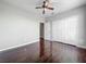 Spacious bedroom with hardwood floors, ceiling fan, closet with bi-fold doors and neutral walls at 2615 Maitland Crossing Way # 9 307, Orlando, FL 32810