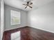Cozy bedroom features a window for natural light and modern ceiling fan at 2615 Maitland Crossing Way # 9 307, Orlando, FL 32810