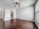 Well-lit bedroom features a ceiling fan, wood floors, closet, and an ensuite bathroom at 2615 Maitland Crossing Way # 9 307, Orlando, FL 32810