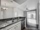 Kitchen with granite countertops, double sink, stainless steel dishwasher and hardwood floors at 2615 Maitland Crossing Way # 9 307, Orlando, FL 32810