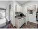 The laundry room offers convenience with modern appliances and ample storage space at 2615 Maitland Crossing Way # 9 307, Orlando, FL 32810