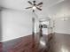 Open-concept living room with hardwood floors, ceiling fan and open concept kitchen at 2615 Maitland Crossing Way # 9 307, Orlando, FL 32810