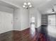 Spacious living room with gorgeous floors, modern lighting, and a view to the outside at 2615 Maitland Crossing Way # 9 307, Orlando, FL 32810