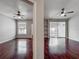 Open concept living room featuring hardwood floors, and sliding glass doors to balcony at 2615 Maitland Crossing Way # 9 307, Orlando, FL 32810