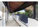 Outdoor balcony with awning and view of neighborhood at 305 Sweetwater Club Cir, Longwood, FL 32779