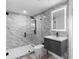 Modern bathroom features marble walls, walk-in shower with black fixtures, and an LED mirror over a floating vanity at 305 Sweetwater Club Cir, Longwood, FL 32779