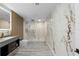 Luxurious bathroom with modern fixtures, marble accents, a walk-in shower, and sleek vanity at 305 Sweetwater Club Cir, Longwood, FL 32779