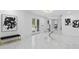 Modern foyer showcasing sleek marble floors, contemporary art, and a stylish entrance at 305 Sweetwater Club Cir, Longwood, FL 32779