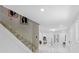 Grand foyer showcases marble staircase, glass railings, and an open view into the spacious living areas at 305 Sweetwater Club Cir, Longwood, FL 32779