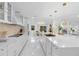 Bright kitchen featuring a large island with seating, modern appliances, and stylish pendant lighting at 305 Sweetwater Club Cir, Longwood, FL 32779