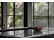 Modern kitchen features elegant countertop and a big window with a nature view at 305 Sweetwater Club Cir, Longwood, FL 32779