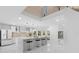 Open concept kitchen with an island, stainless steel appliances, and modern light fixtures at 305 Sweetwater Club Cir, Longwood, FL 32779