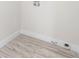 Bright laundry room features durable laminate flooring and modern utility connections at 305 Sweetwater Club Cir, Longwood, FL 32779