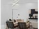 Bright living room with a modern light fixture, artwork, stylish furniture and decor at 305 Sweetwater Club Cir, Longwood, FL 32779