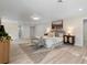 Spacious main bedroom with a serene atmosphere features neutral colors, a decorative rug, and modern furniture at 305 Sweetwater Club Cir, Longwood, FL 32779