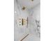 A detailed view of the shower features marble tile and custom hardware at 305 Sweetwater Club Cir, Longwood, FL 32779