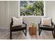 Bright sitting area with modern decor and furniture, view of the picturesque yard at 305 Sweetwater Club Cir, Longwood, FL 32779