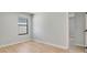 Inviting bedroom with a window offering natural light and wood-look floors for a cozy feel at 3397 Tranquil Trl, Kissimmee, FL 34747