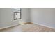 Bright room featuring light wood flooring and natural light from a large window at 3397 Tranquil Trl, Kissimmee, FL 34747