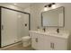 Clean bathroom with a glass shower, double sink vanity, and modern fixtures for a refreshing experience at 3553 Sw 157Th Loop, Ocala, FL 34473