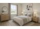 Serene bedroom with neutral decor, a comfortable bed, soft lighting, and a view from the window at 3553 Sw 157Th Loop, Ocala, FL 34473