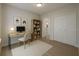 Functional home office with a desk, bookshelf, closet, and ample natural light for a productive workspace at 3553 Sw 157Th Loop, Ocala, FL 34473