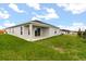 A covered backyard patio offers an inviting extension to the home, perfect for relaxation and outdoor enjoyment at 640 Royal Palm Dr, Dundee, FL 33838