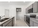 Modern kitchen featuring granite countertops, stainless steel appliances, and ample cabinet space at 640 Royal Palm Dr, Dundee, FL 33838