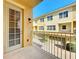 Private balcony overlooking a courtyard and other townhomes in the community at 728 Greybull Run, Lake Mary, FL 32746