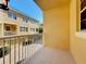 Balcony view overlooking garages and townhomes with brick driveways at 728 Greybull Run, Lake Mary, FL 32746