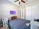 Bedroom with a queen bed, tv, and closet at 728 Greybull Run, Lake Mary, FL 32746